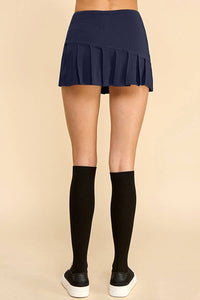 KNIFE PLEATED SKORT: NAVY