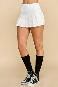 KNIFE PLEATED SKORT: SOFT WHITE