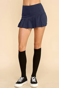 KNIFE PLEATED SKORT: NAVY