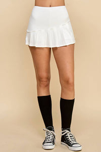 KNIFE PLEATED SKORT: SOFT WHITE