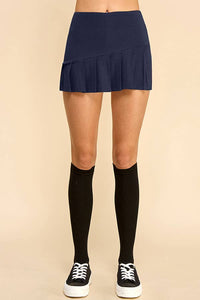 KNIFE PLEATED SKORT: NAVY
